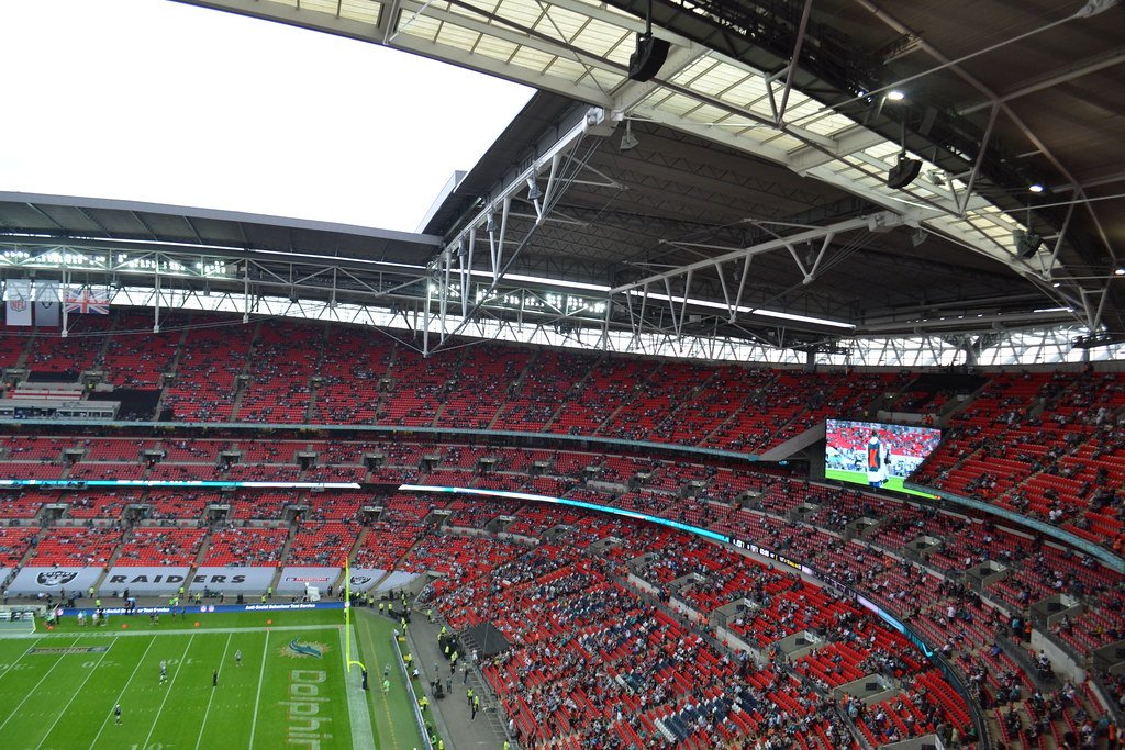 Wembley Stadium in London during an NFL game, with fans filling the stands